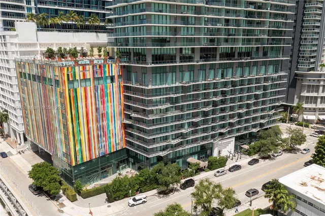 a view of a building with a backyard