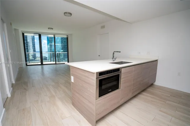 a kitchen that has a sink and a stove