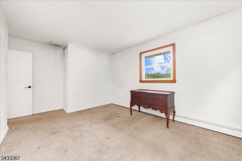 650 Woodglen Road Glen Gardner, NJ 08826 - Photo 16 of 28 a view of an empty room with a workspace