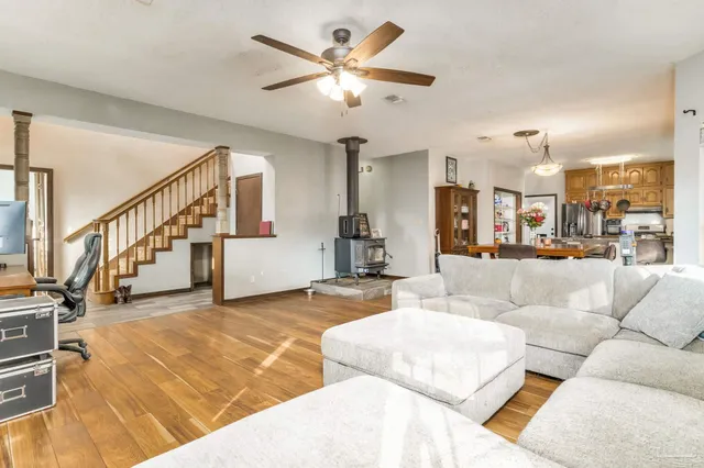 a living room with furniture and kitchen view