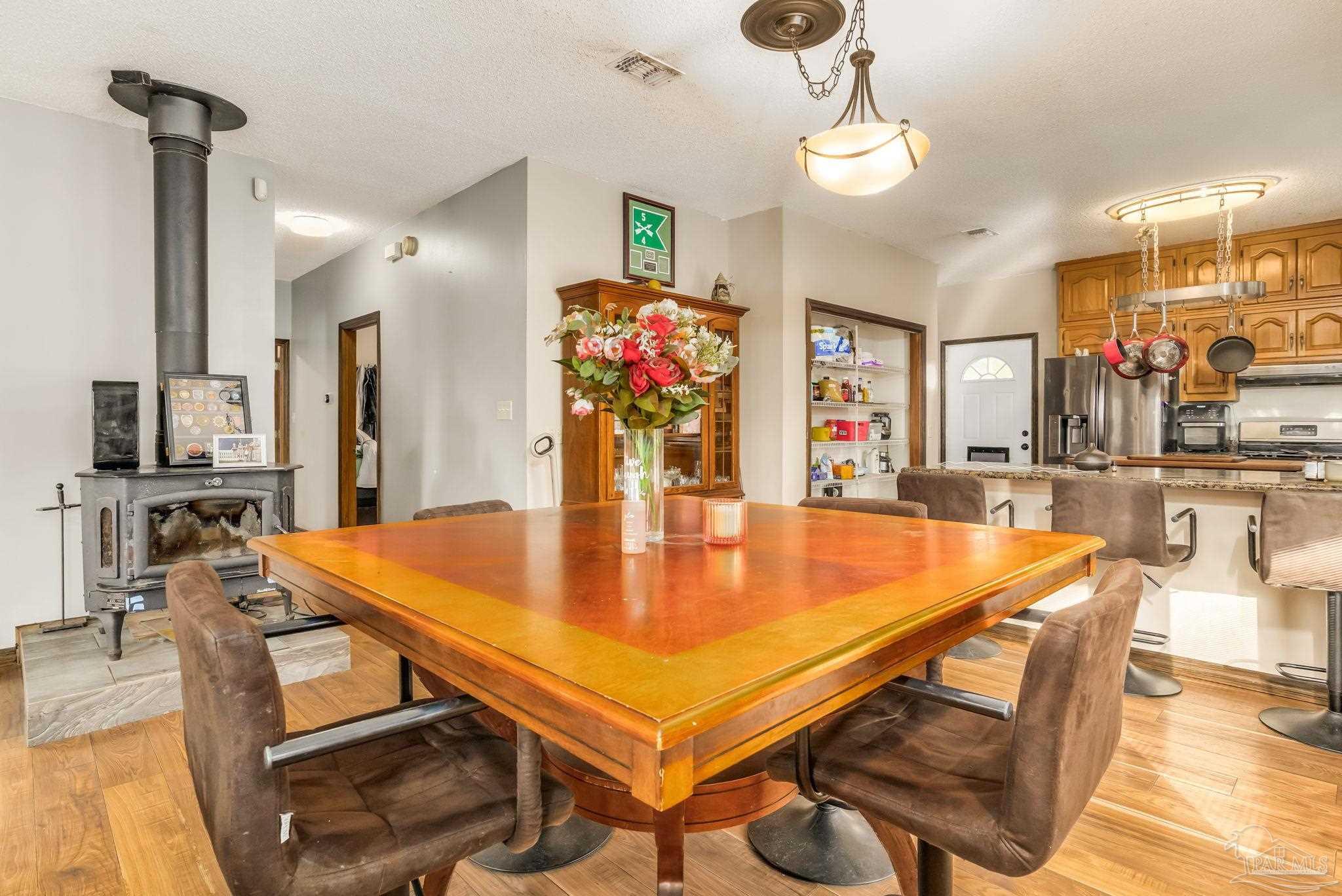 4616 B B Lowery Road Milton, FL 32583 - Photo 17 of 35 a room with table and chairs