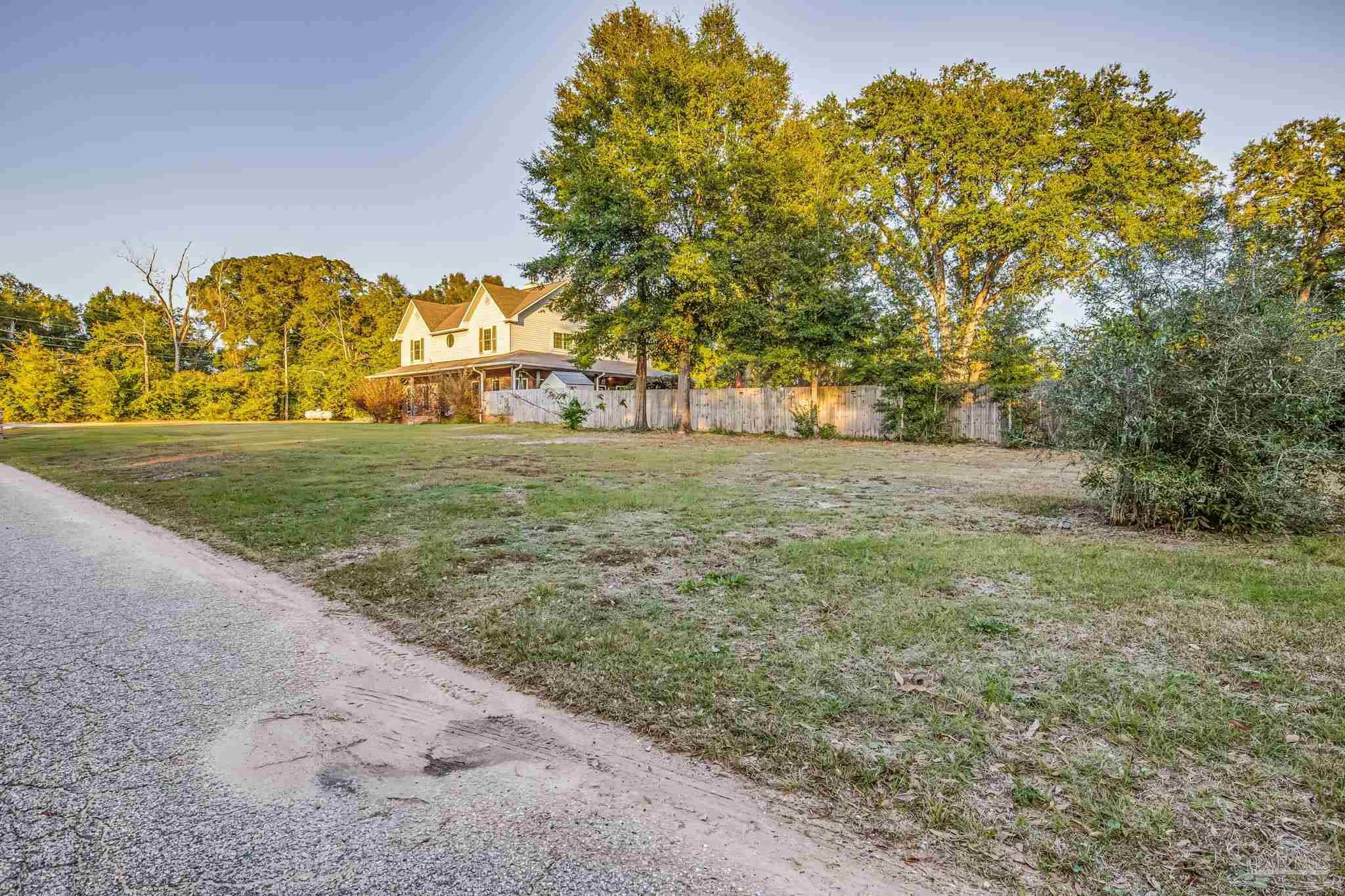 4616 B B Lowery Road Milton, FL 32583 - Photo 2 of 35 a view of a big yard with large trees