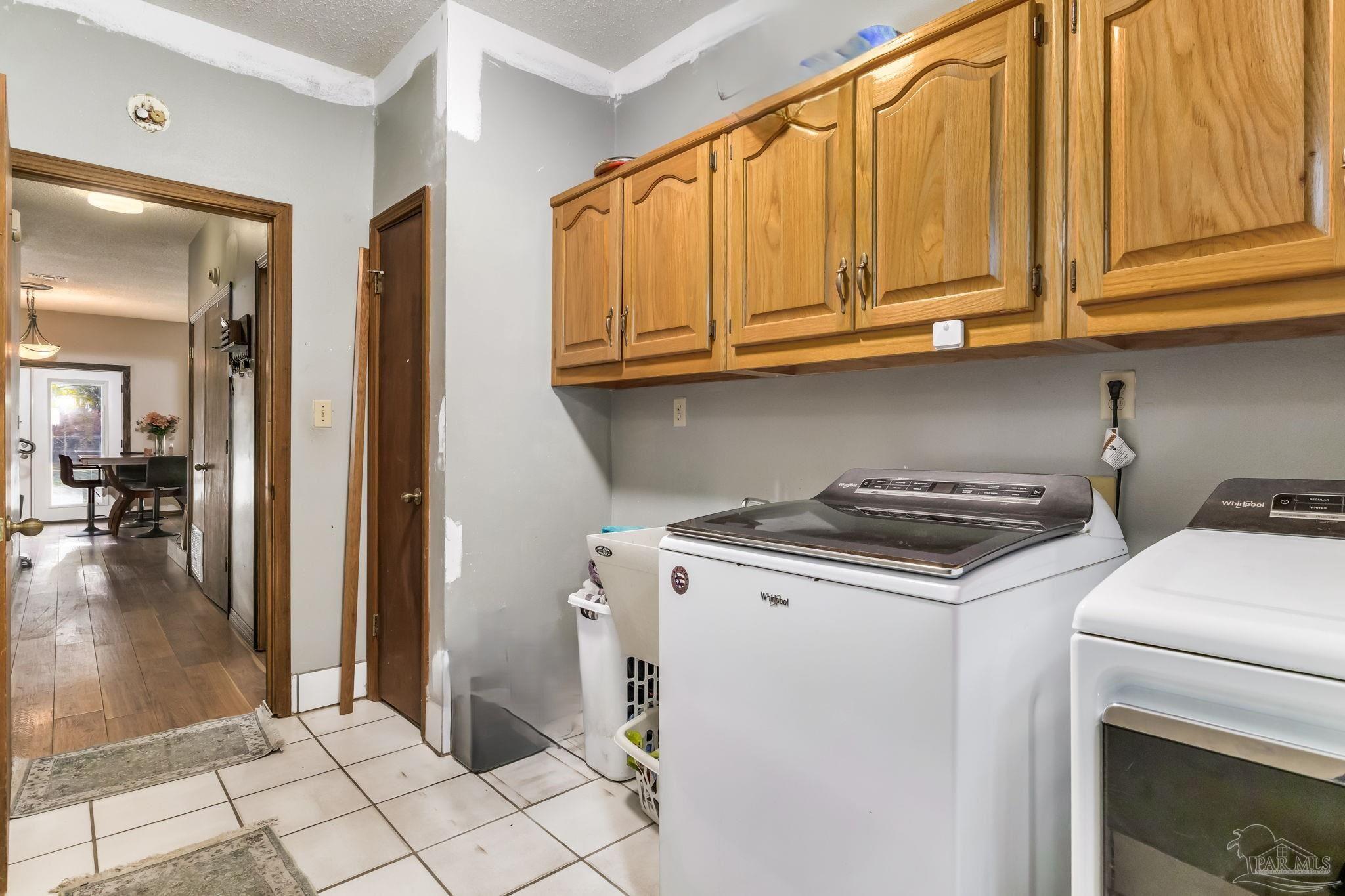 4616 B B Lowery Road Milton, FL 32583 - Photo 21 of 35 a kitchen with a stove and a refrigerator