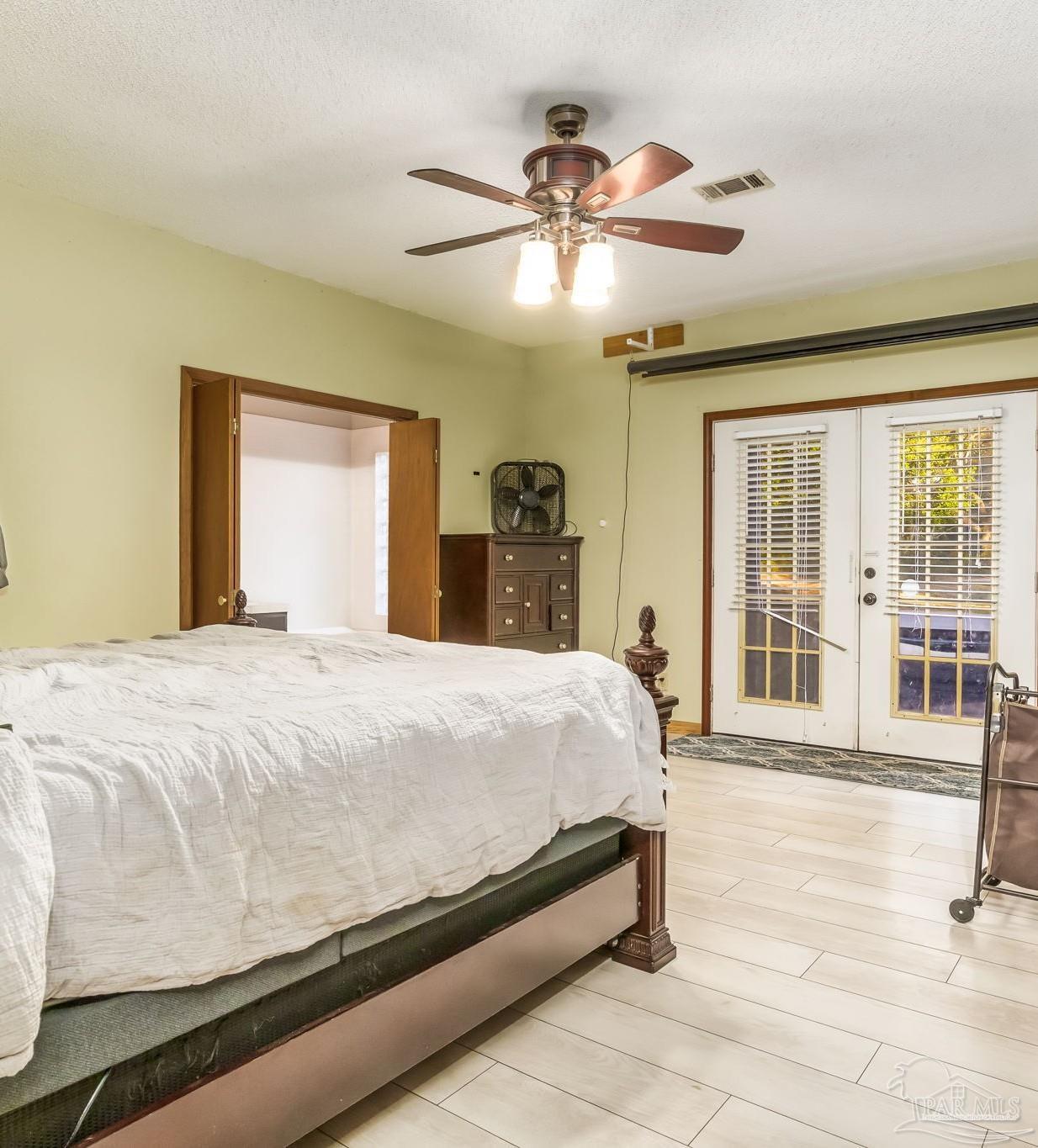 4616 B B Lowery Road Milton, FL 32583 - Photo 23 of 35 a bedroom with a bed and a large window