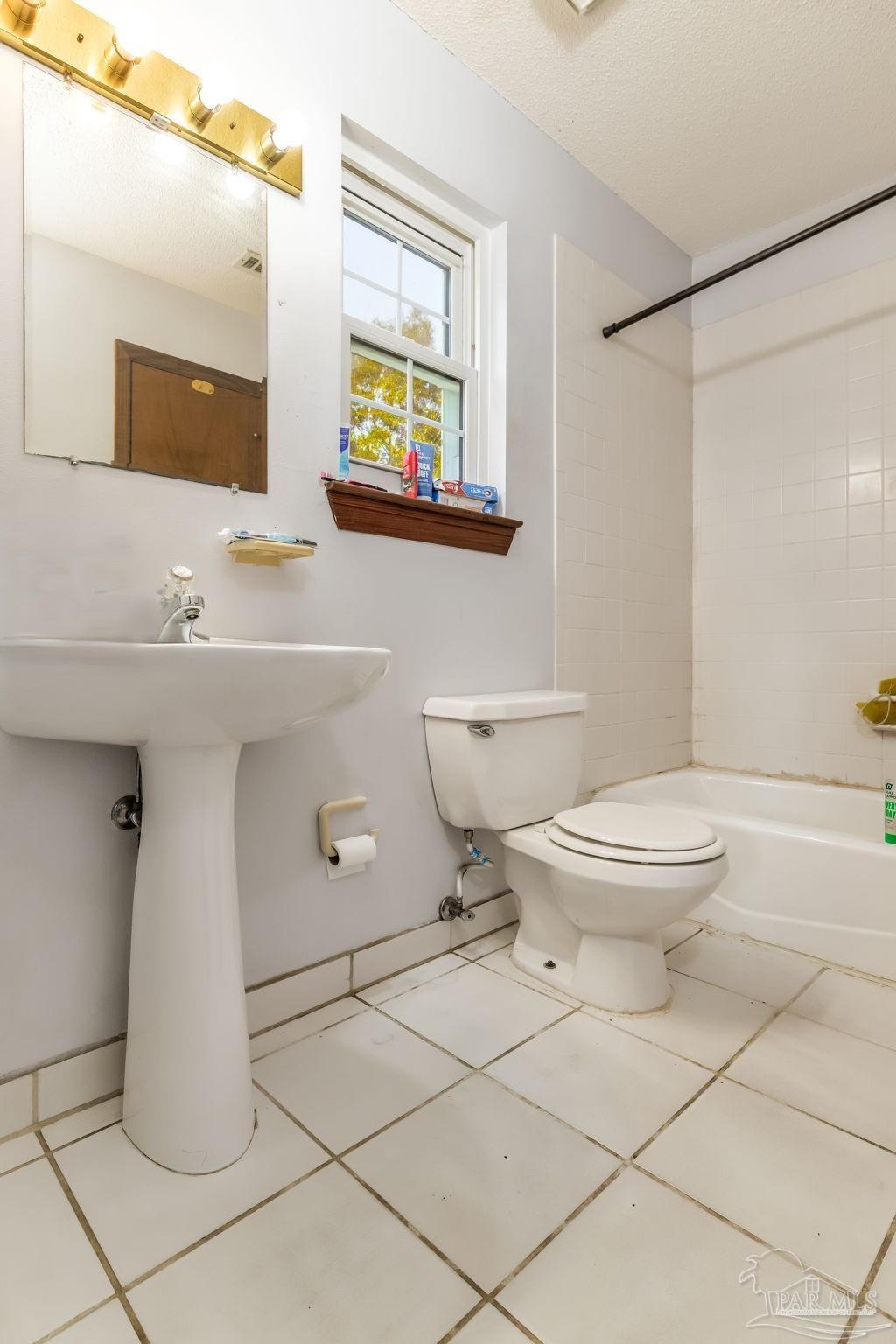 4616 B B Lowery Road Milton, FL 32583 - Photo 33 of 35 a bathroom with a toilet sink and mirror