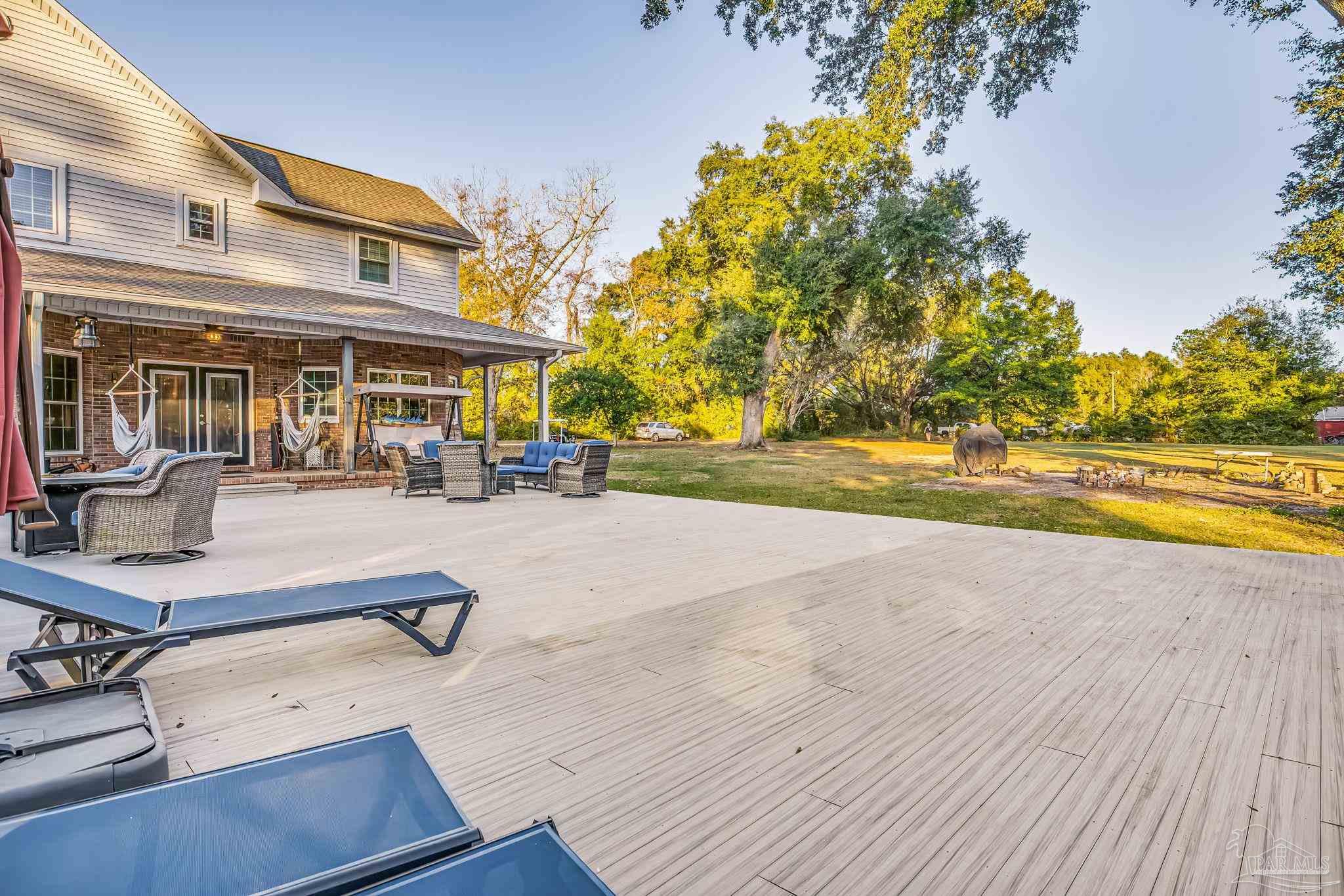 4616 B B Lowery Road Milton, FL 32583 - Photo 6 of 35 a view of a swimming pool with a patio