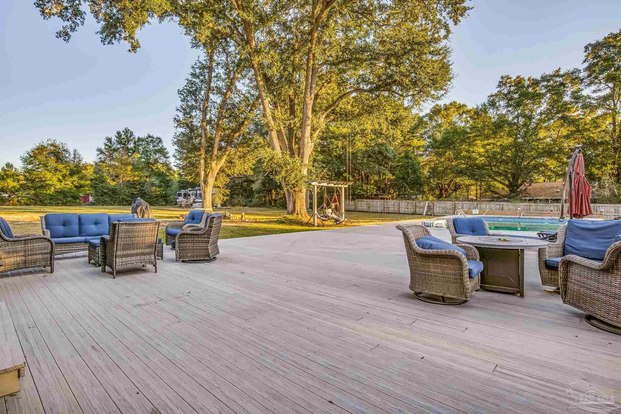 4616 B B Lowery Road Milton, FL 32583 - Photo 8 of 35 a view of a terrace with furniture and garden
