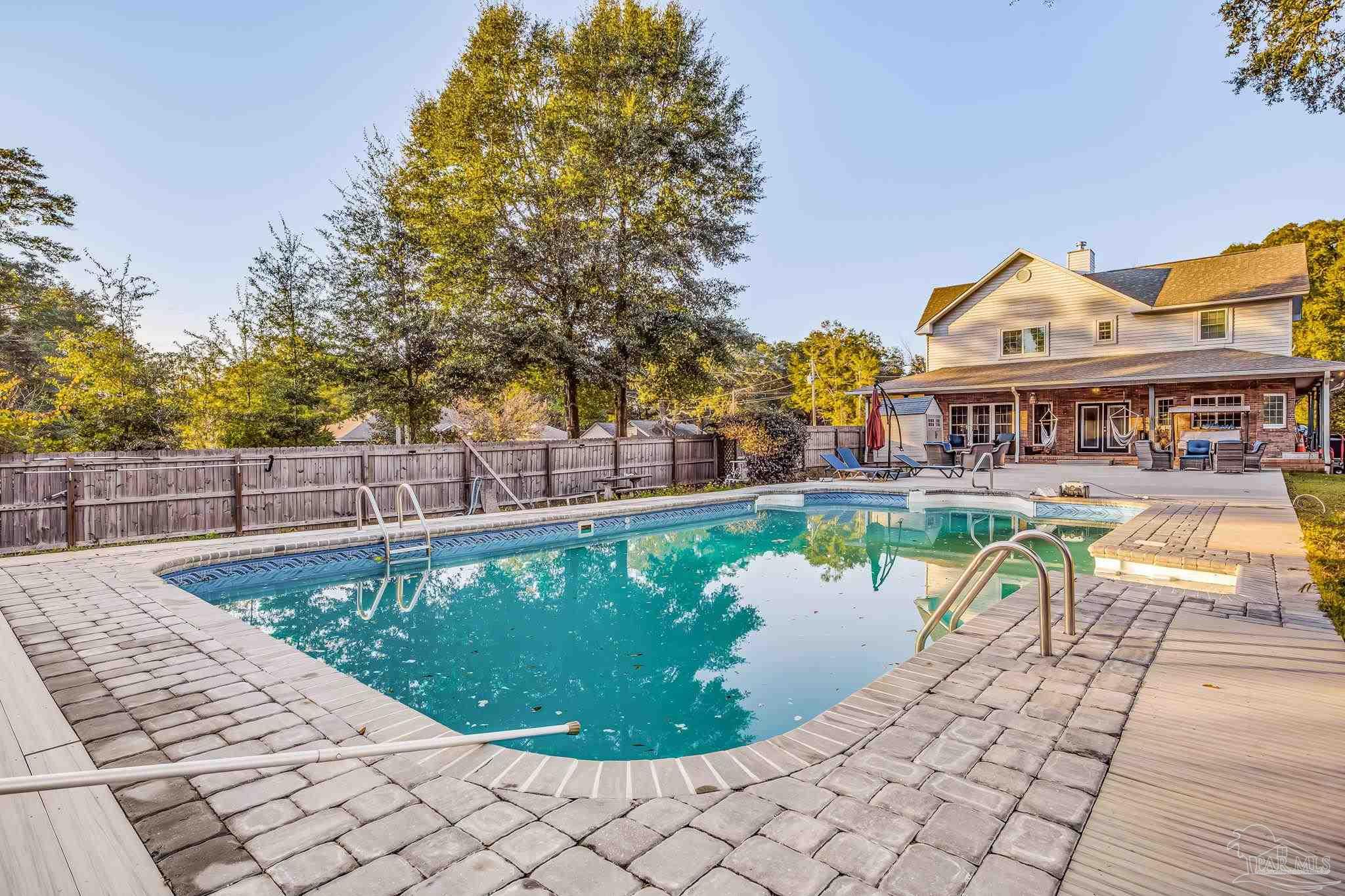 4616 B B Lowery Road Milton, FL 32583 - Photo 9 of 35 a view of a swimming pool with a patio