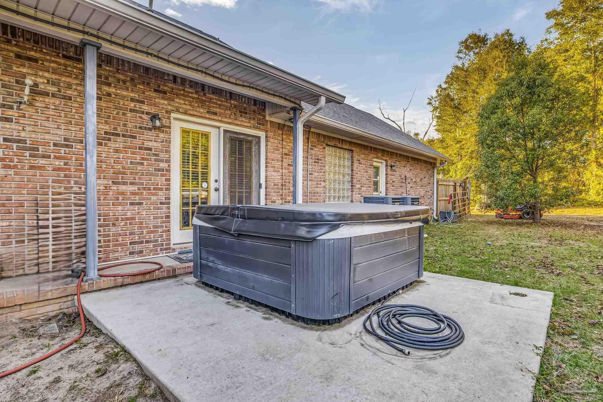 4616 B B Lowery Road Milton, FL 32583 - Photo 10 of 35 a view of backyard with outdoor seating