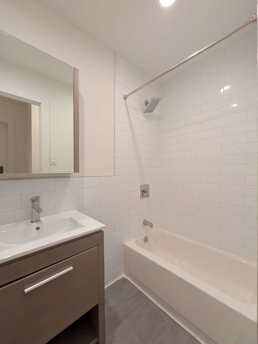 416 West 23rd Street, Unit 1A Manhattan, NY 10011 - Photo 5 of 9 a bathroom with a sink and a bathtub
