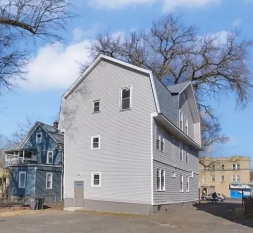 a view of a house with a street