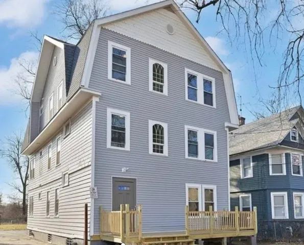a front view of a house with a yard