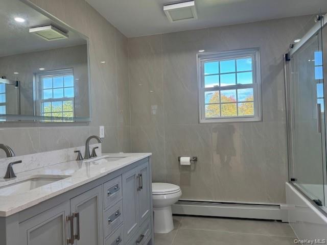 648 Old Country Road, Unit 2 Plainview, NY 11803 - Photo 6 of 13 a bathroom with a granite countertop sink toilet and shower