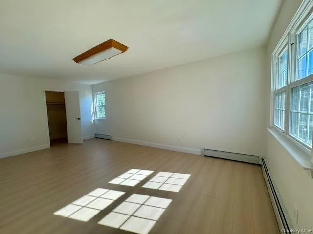 an empty room with windows