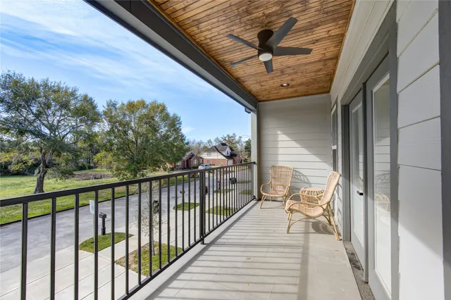 a view of a balcony with furniture