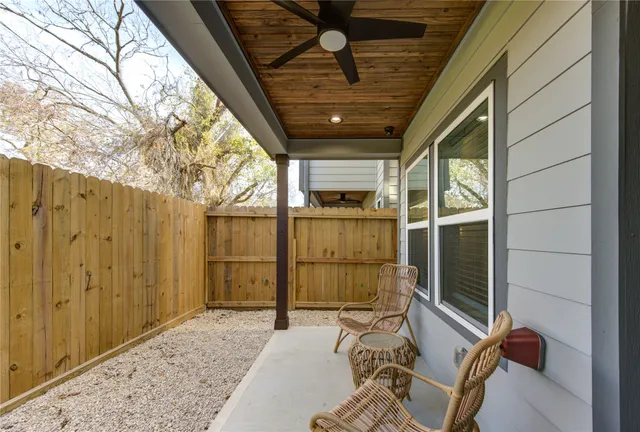 a view of a porch with wooden floor