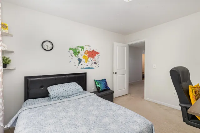 a bedroom with a bed and furniture