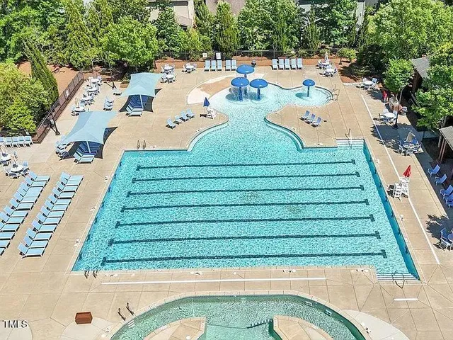 an aerial view of a house with a garden