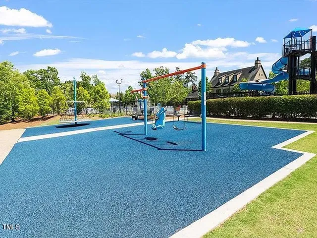 a view of a playground with basketball court