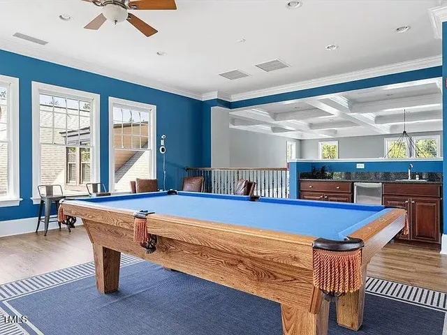 a kitchen with stainless steel appliances kitchen island granite countertop furniture and a large window