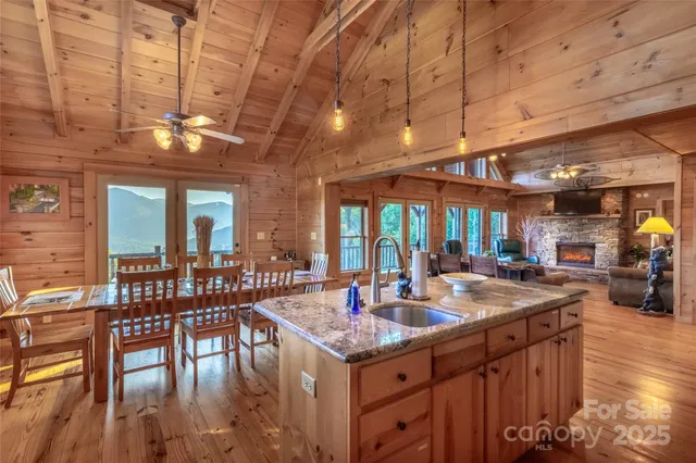 a view of a dining room with furniture wooden floor and a chandelier