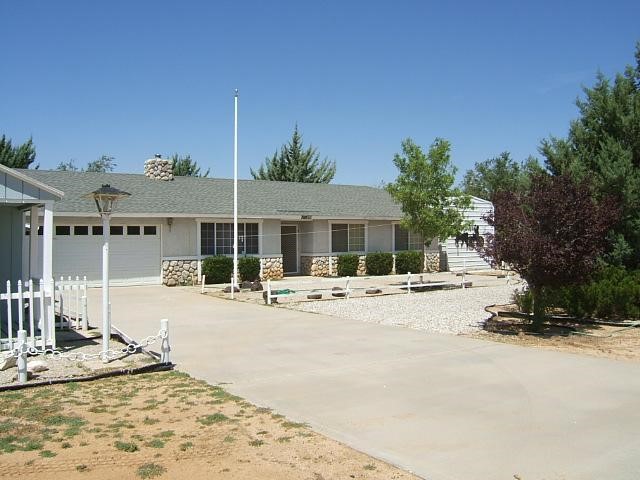 10860 Chipmunk Road Apple Valley, CA 92308 - Photo 1 of 1 a view of a house with outdoor space and sitting area