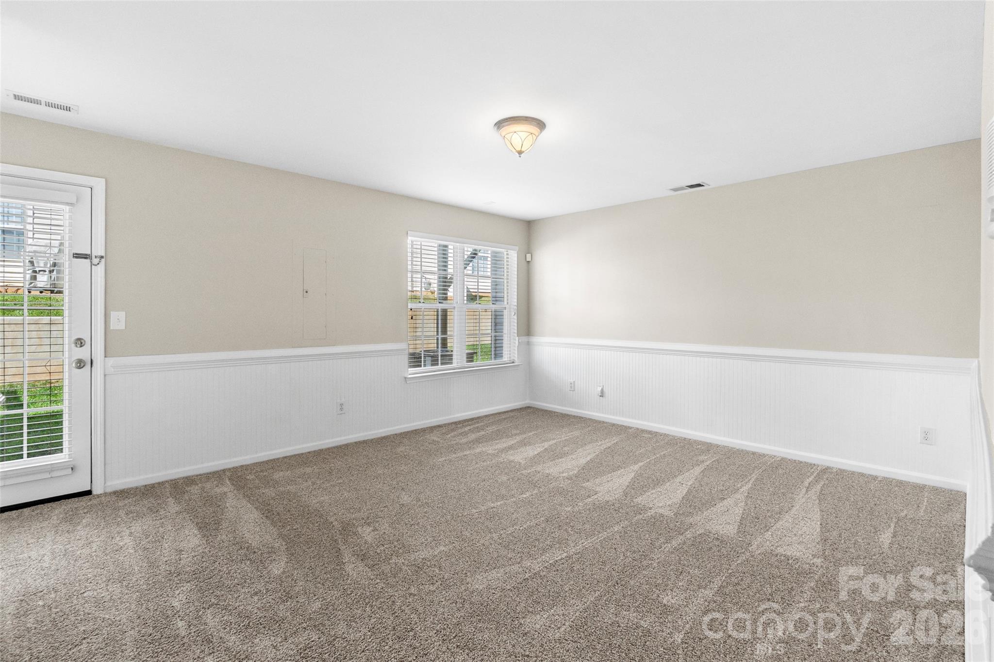 104 Rock Ridge Lane Mount Holly, NC 28120 - Photo 5 of 48 a view of an empty room with a window
