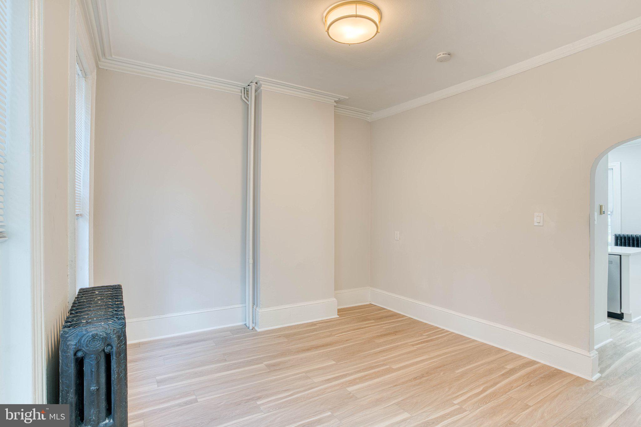 307 Kings Highway East, Unit 2 Haddonfield, NJ 08033 - Photo 13 of 21 a view of a room with wooden floor and brick walls
