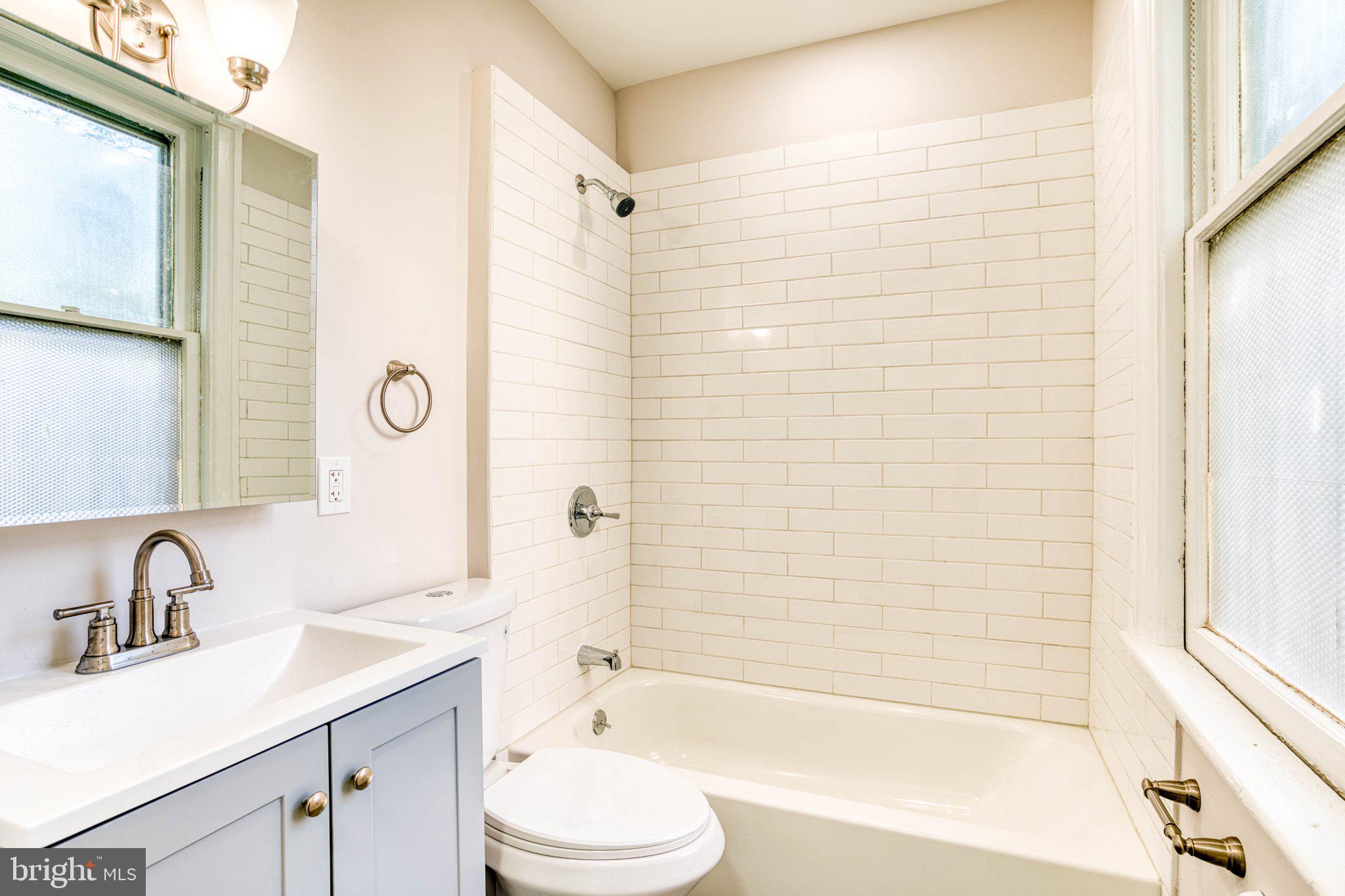 307 Kings Highway East, Unit 2 Haddonfield, NJ 08033 - Photo 15 of 21 a bathroom with a sink toilet and shower