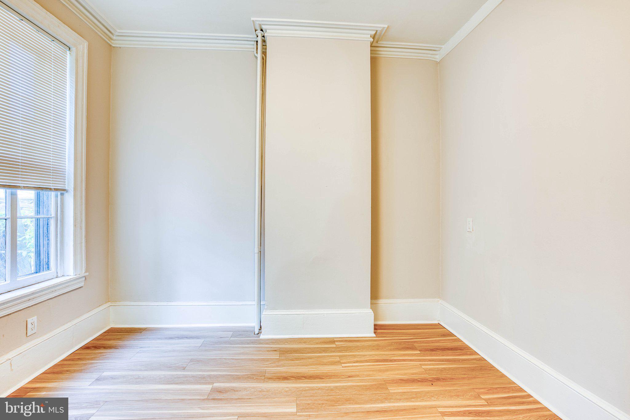 307 Kings Highway East, Unit 2 Haddonfield, NJ 08033 - Photo 19 of 21 a view of an empty room with wooden floor