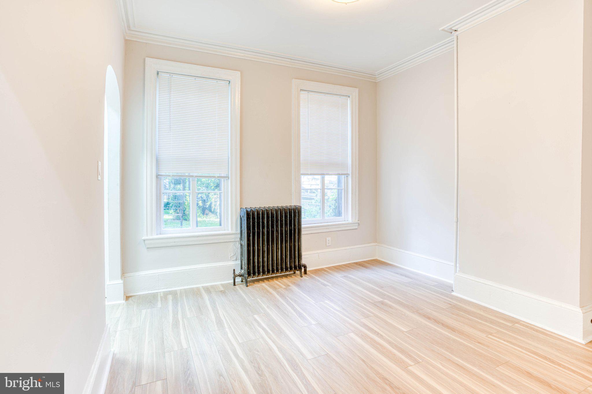 307 Kings Highway East, Unit 2 Haddonfield, NJ 08033 - Photo 20 of 21 a view of an empty room with a window and wooden floor