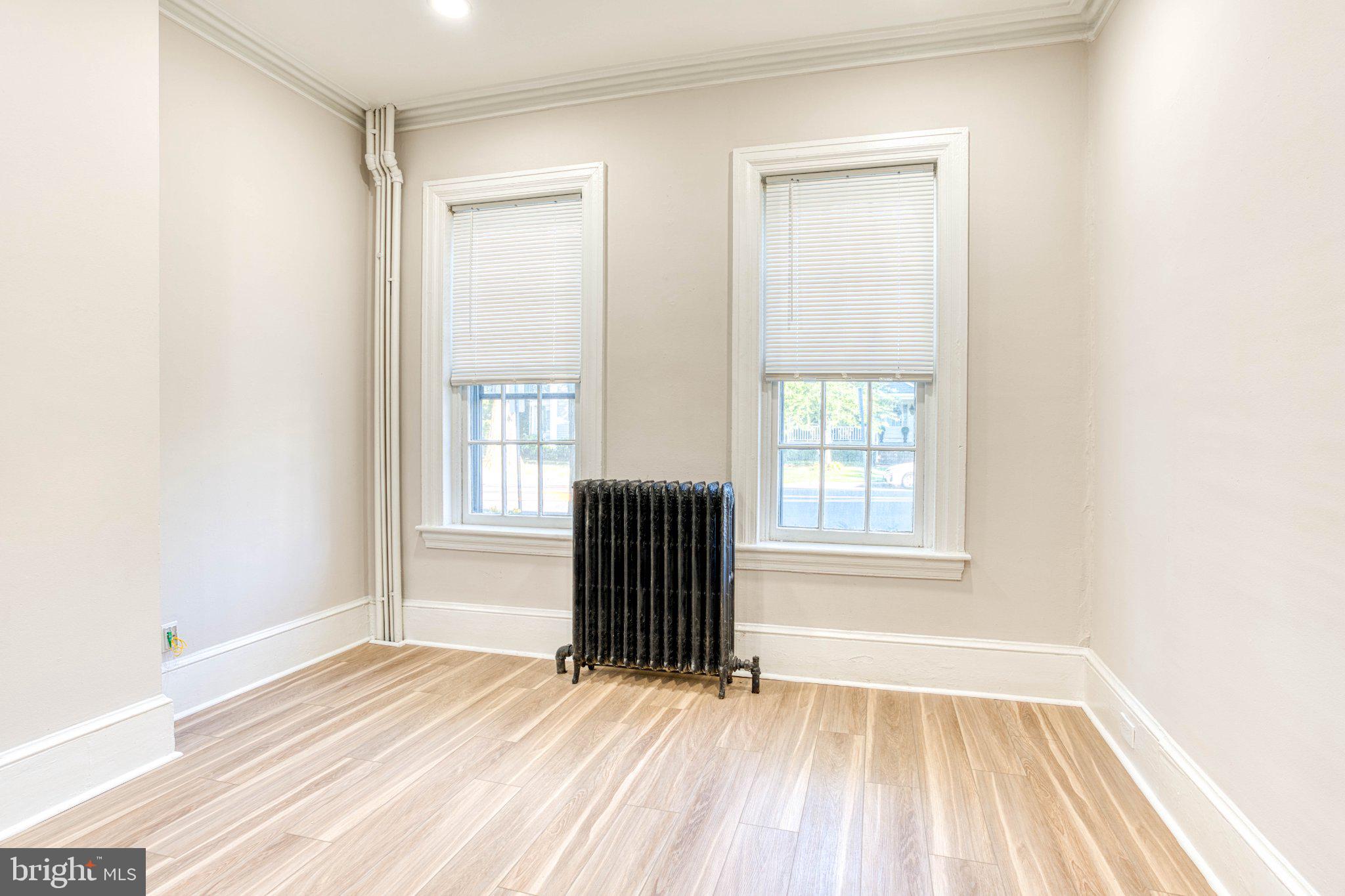 307 Kings Highway East, Unit 2 Haddonfield, NJ 08033 - Photo 21 of 21 a view of empty room with wooden floor and fan