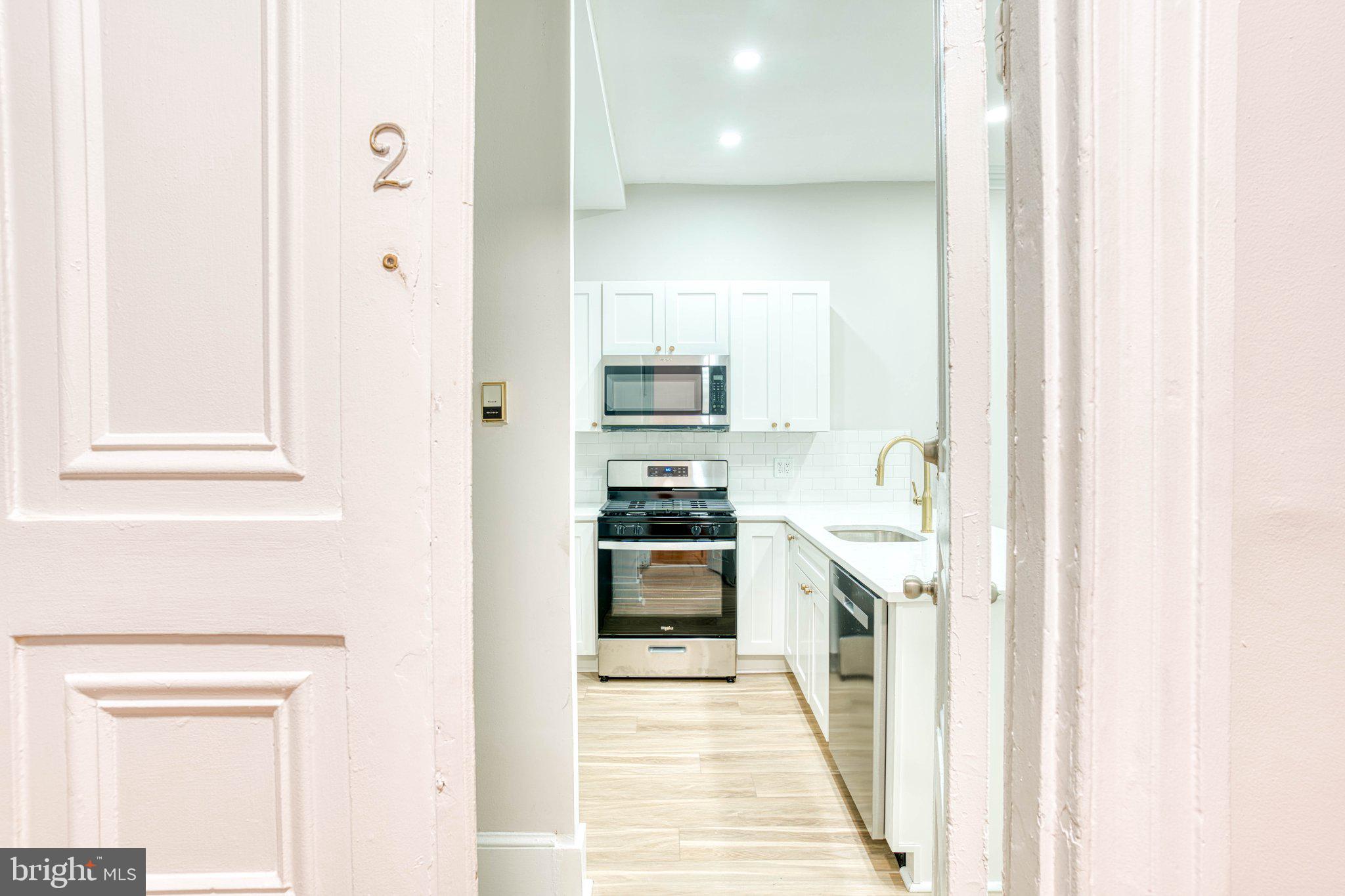 307 Kings Highway East, Unit 2 Haddonfield, NJ 08033 - Photo 4 of 21 a view of a kitchen from a hallway