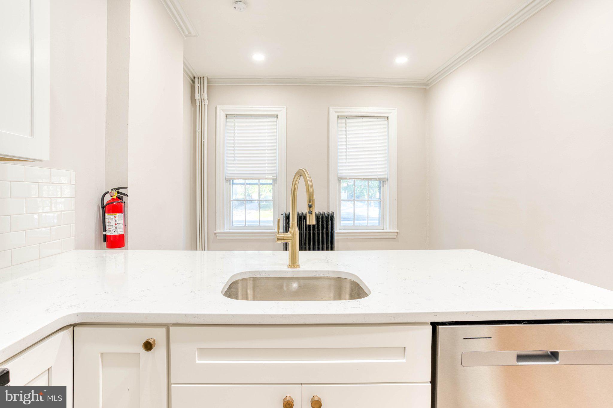 307 Kings Highway East, Unit 2 Haddonfield, NJ 08033 - Photo 9 of 21 a bathroom with a sink and a mirror