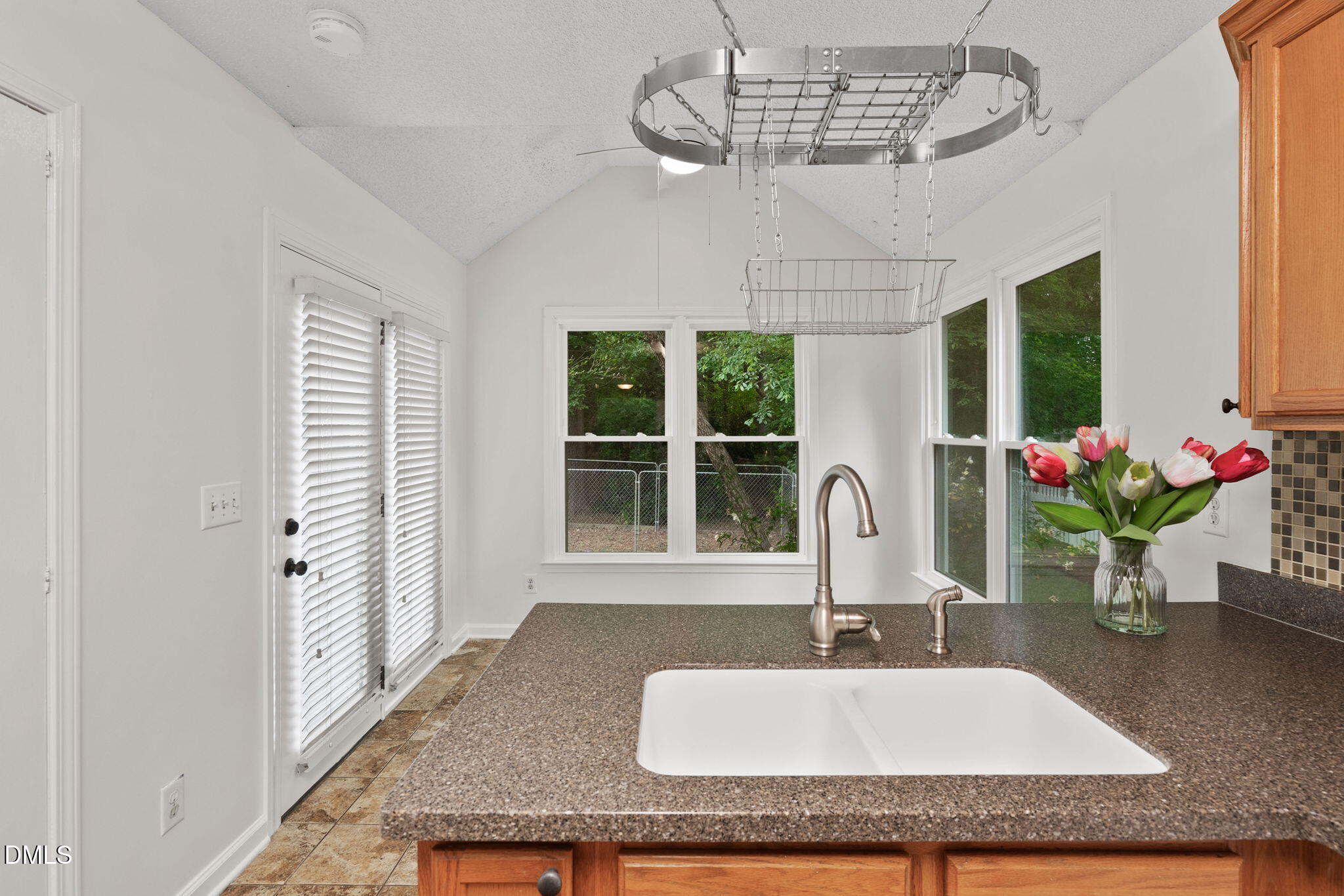 2724 Glastonbury Road Apex, NC 27539 - Photo 19 of 50 a bathroom with a granite countertop sink and a mirror