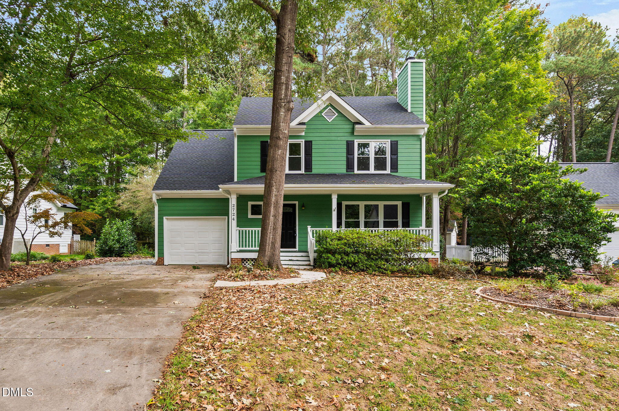 2724 Glastonbury Road Apex, NC 27539 - Photo 2 of 50 a front view of a house with garden