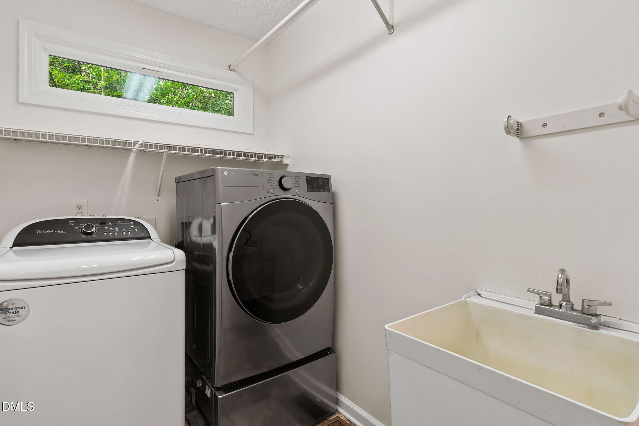 2724 Glastonbury Road Apex, NC 27539 - Photo 24 of 50 a utility room with dryer and washer