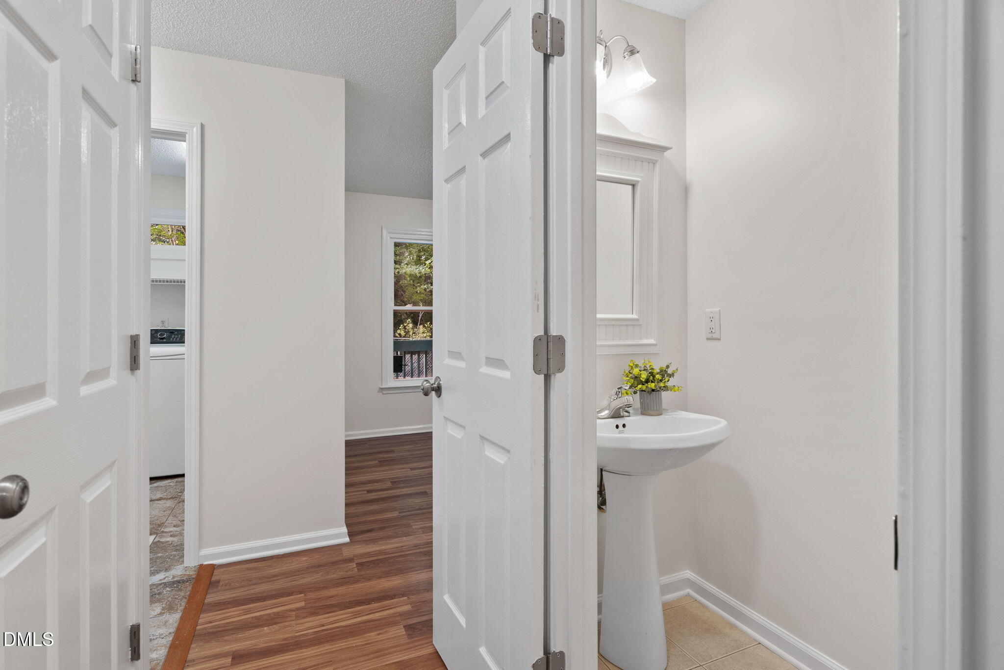 2724 Glastonbury Road Apex, NC 27539 - Photo 25 of 50 a room with a table and chairs