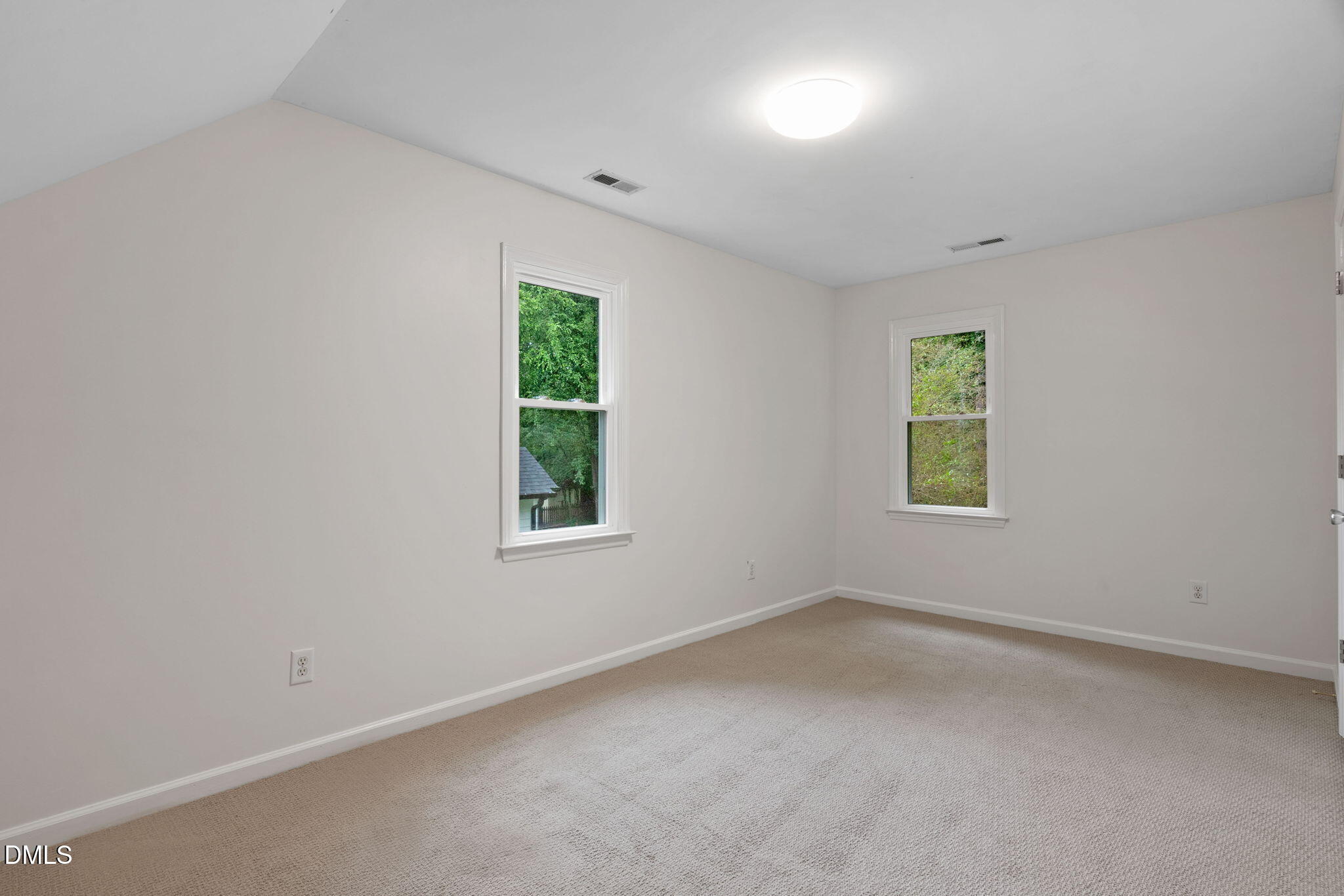 2724 Glastonbury Road Apex, NC 27539 - Photo 26 of 50 an empty room with windows