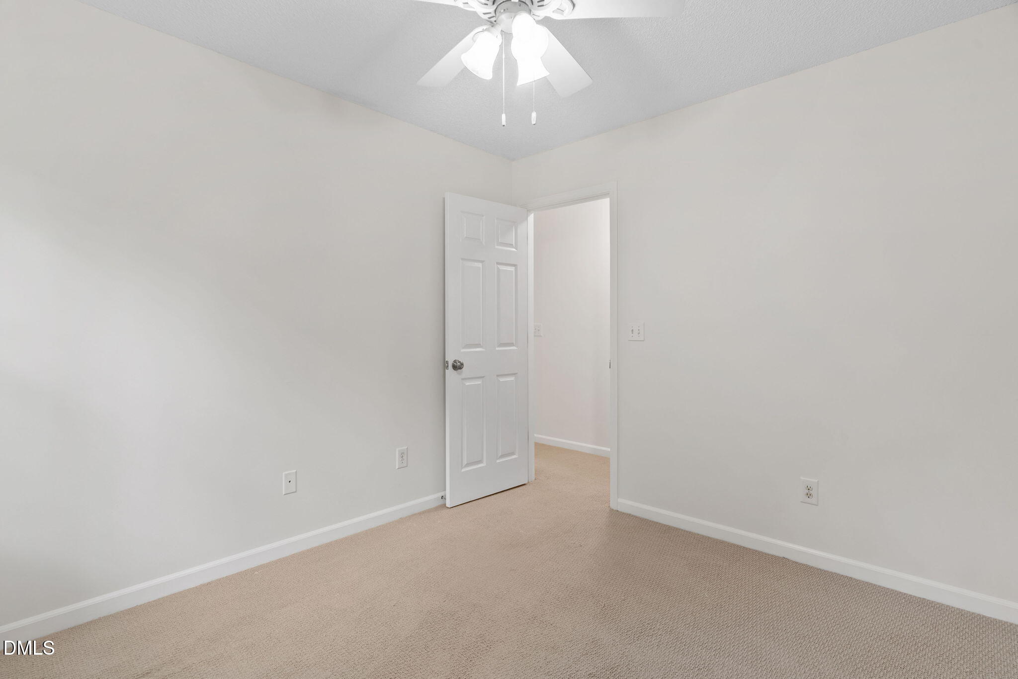 2724 Glastonbury Road Apex, NC 27539 - Photo 29 of 50 an empty room with a chandelier fan and closet