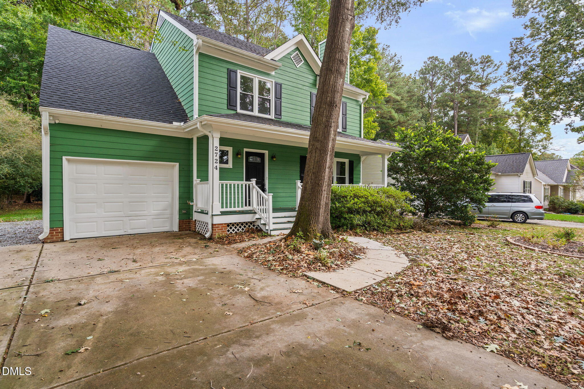 2724 Glastonbury Road Apex, NC 27539 - Photo 3 of 50 a front view of a house with a garden