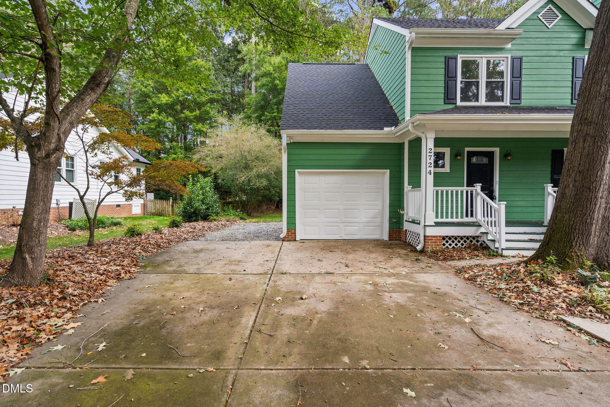 2724 Glastonbury Road Apex, NC 27539 - Photo 4 of 50 a house with a tree in front of it