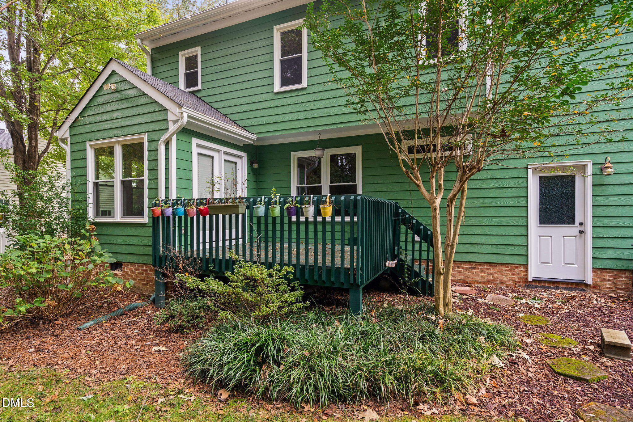 2724 Glastonbury Road Apex, NC 27539 - Photo 42 of 50 a front view of a house with a garden