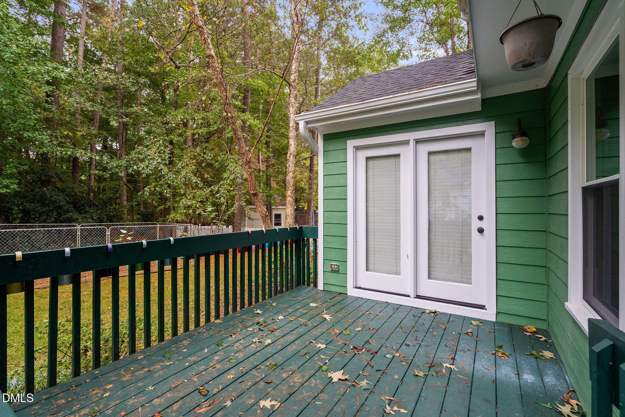 2724 Glastonbury Road Apex, NC 27539 - Photo 46 of 50 a view of a wooden door and a yard