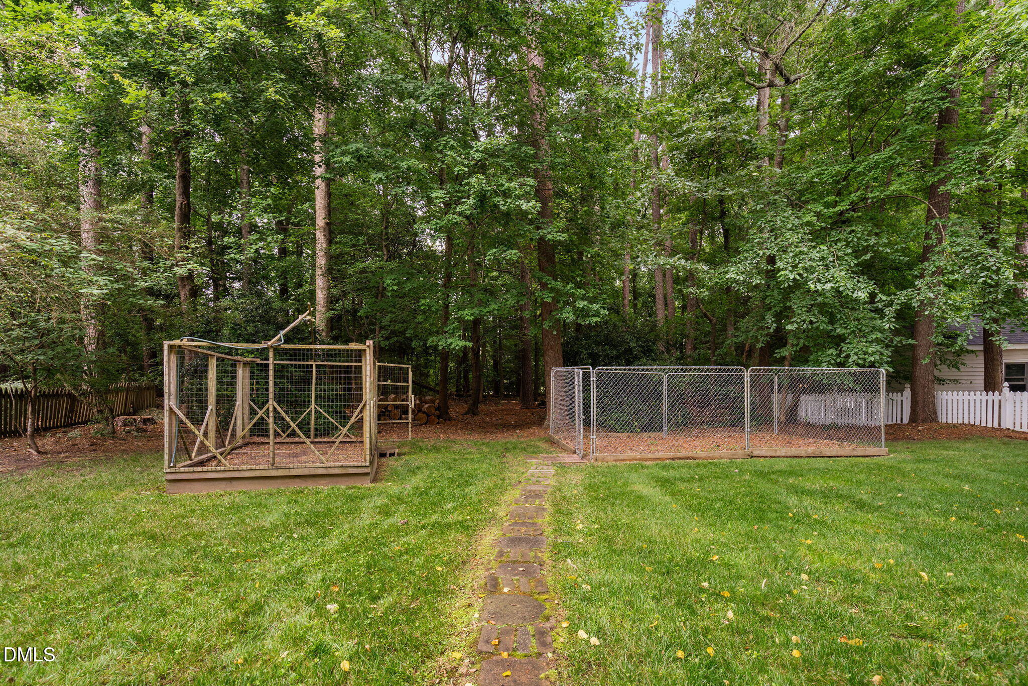 2724 Glastonbury Road Apex, NC 27539 - Photo 48 of 50 a view of a backyard with sitting area