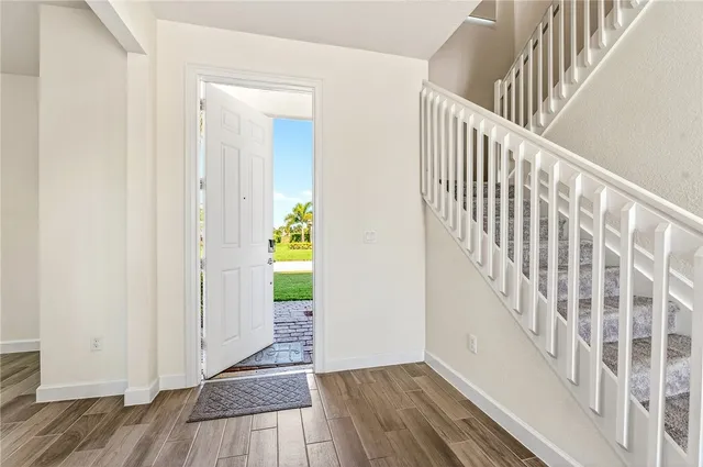 a view of entryway with wooden floor