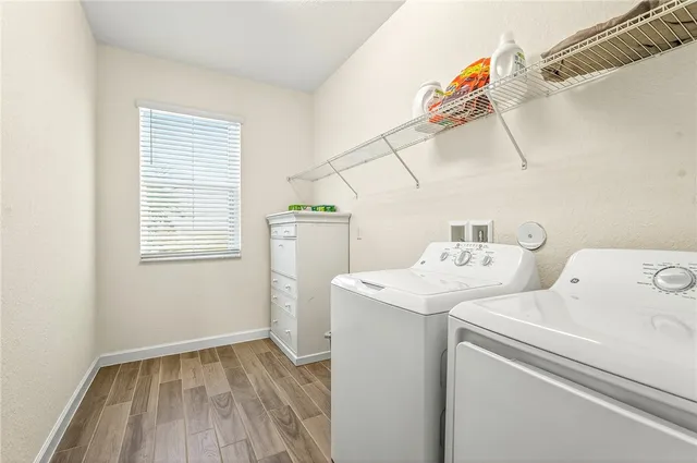 a view of storage and utility room with washer and dryer