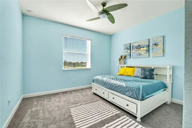 a living room with a bed and a couch