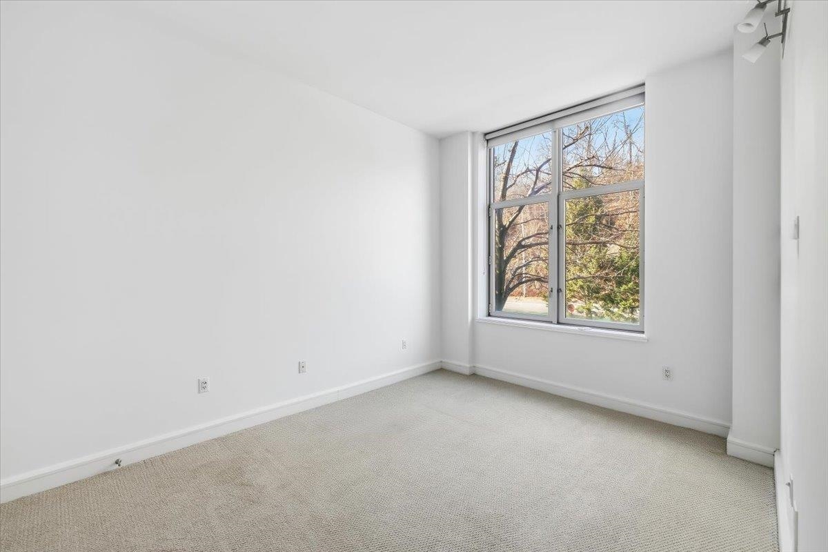 8100 River Road, Unit 209 North Bergen, NJ 07047 - Photo 13 of 42 an empty room with a window
