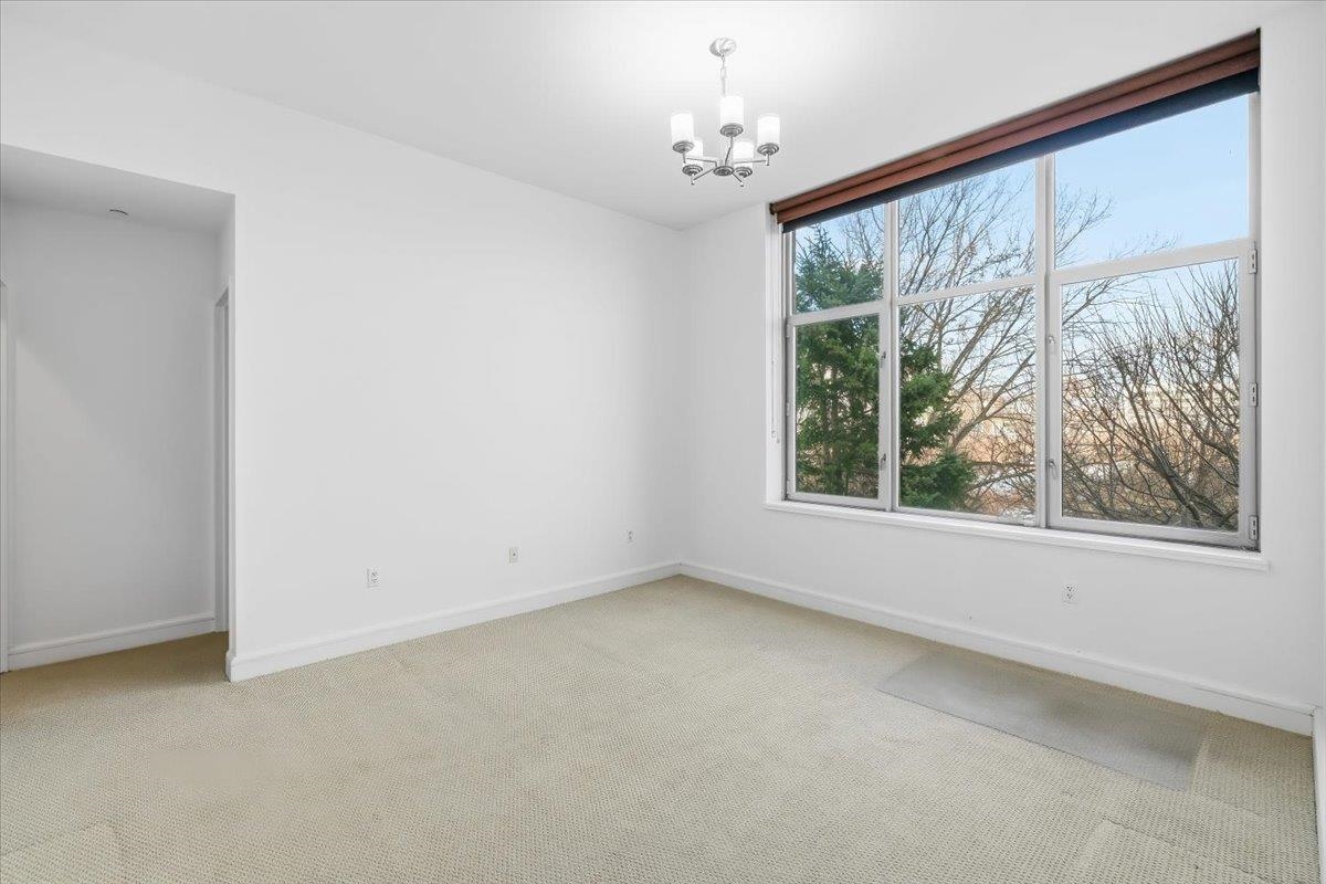 8100 River Road, Unit 209 North Bergen, NJ 07047 - Photo 19 of 42 a view of an empty room with a window